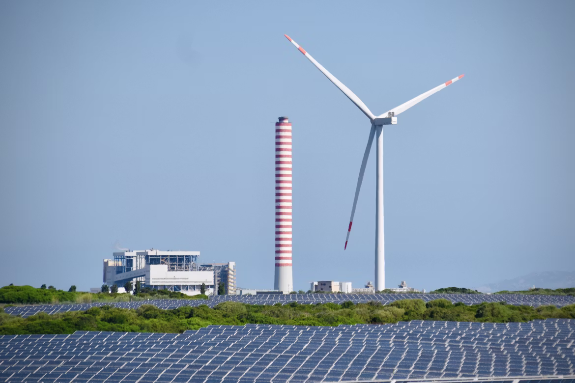 Solar panel array and wind turbines at a renewable energy farm