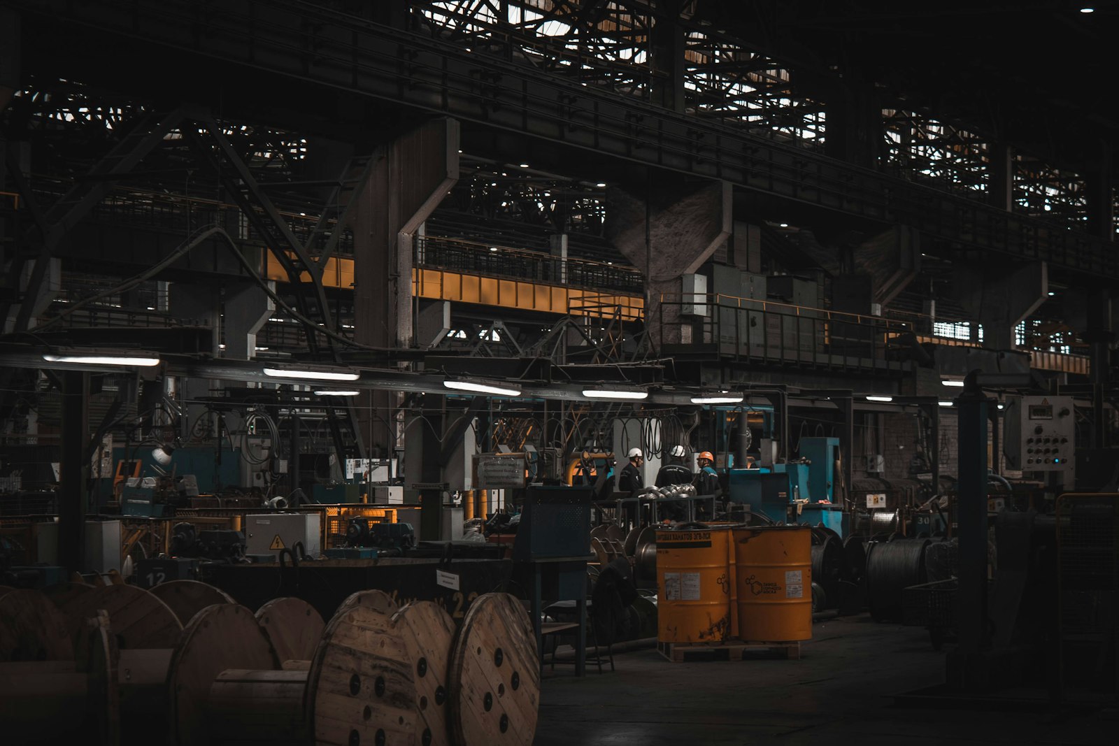 Engineer monitoring equipment on a factory floor